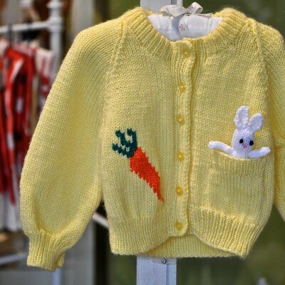 Baby Gifts - Baby sweaters with knitted toy in pocket by Laura Stark.